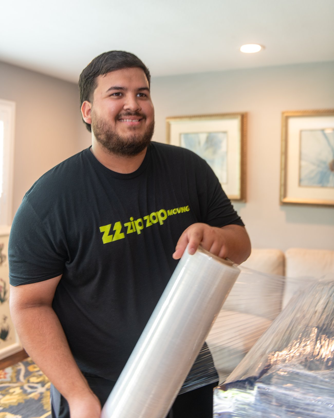 Zip Zap Moving crew carefully wrapping furniture in McKinney TX