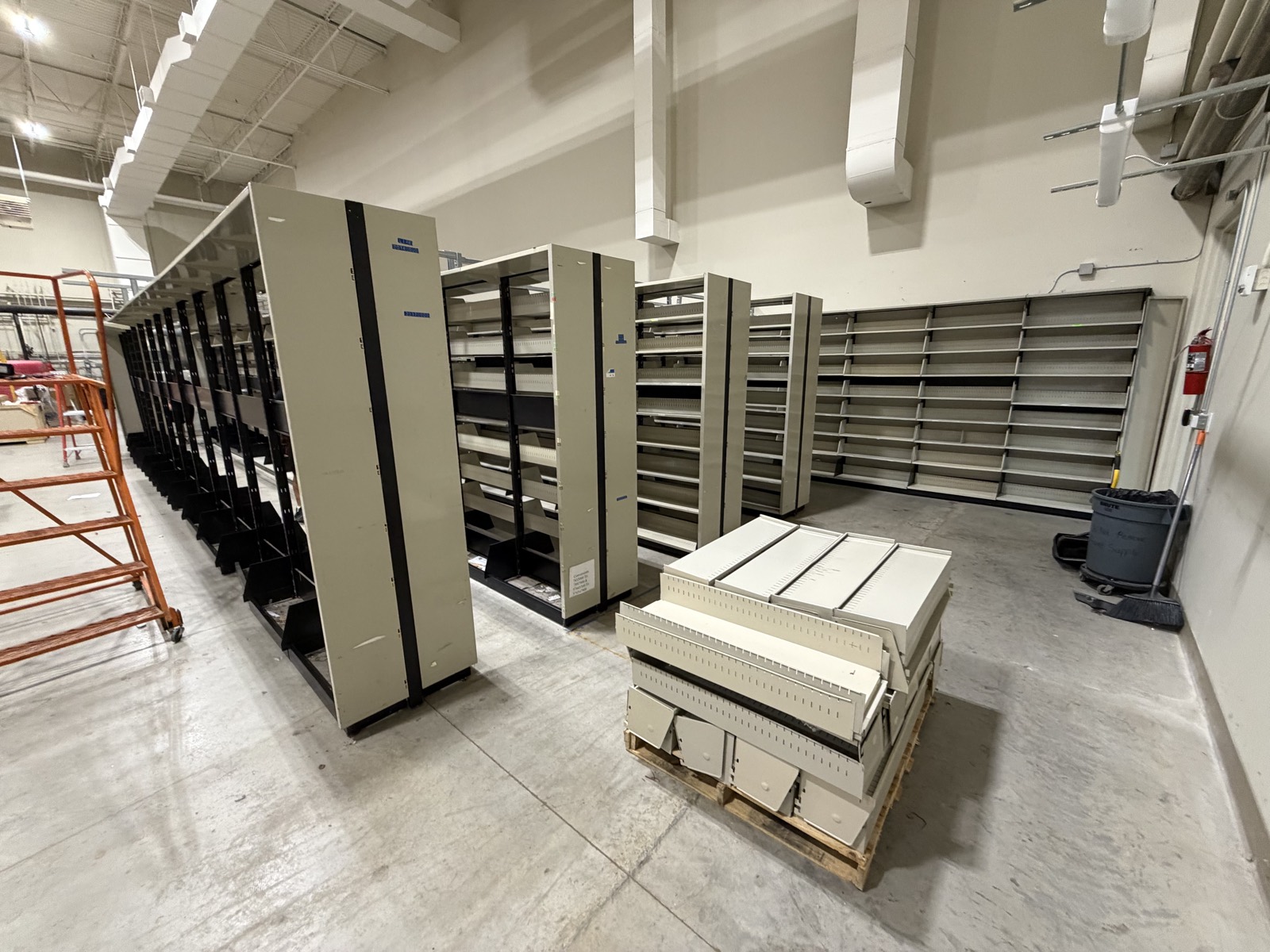 Rows of commercial shelving staged during a Zip Zap Moving office relocation in McKinney TX