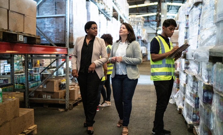 Warehouse team discussing logistics