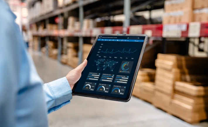 Warehouse worker using digital tablet